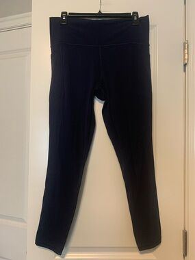 Athleta Navy Salutation Stash Tight, Sz L, 25in GUC, some wash wear